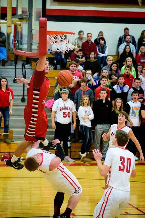 Slam dunk by Lutheran School basketball player